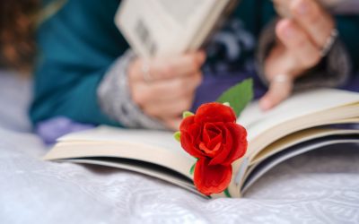 unrecognizable woman reading a book with a rose. Independence day of Catalonia. Sant Jordi. unrecognizable woman reading a book with a rose. Independence day of Catalonia. Sant Jordi.
